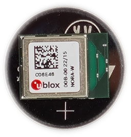 NORA-W4 module placed on top of a standard CR2032 coin-cell battery