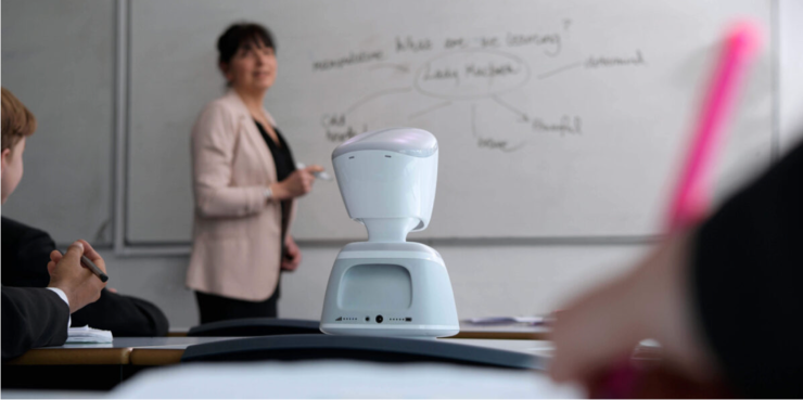 A teacher standing in front of the class